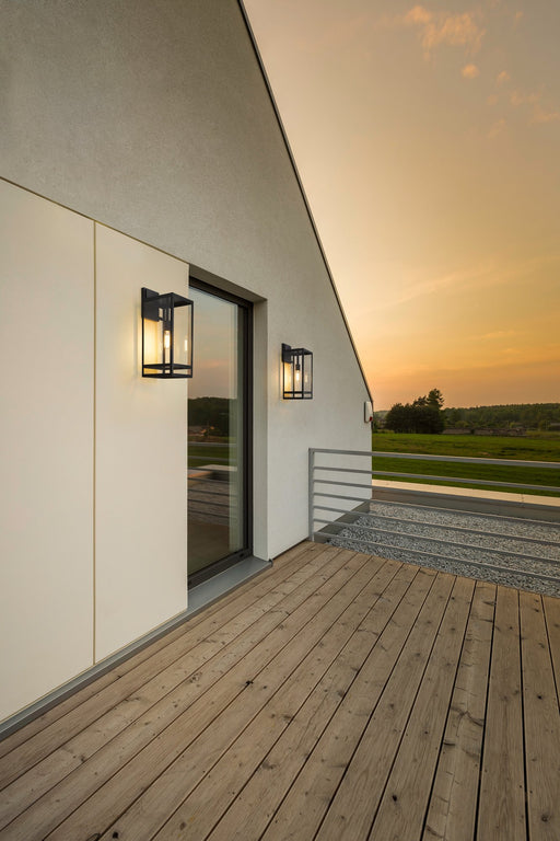 Nuri 1 Light 7.5" Outdoor Wall Light, 21.25" Tall in Black in a room setting
