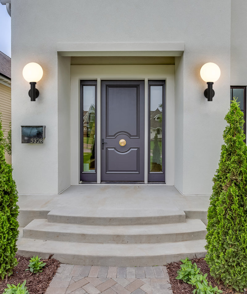 Laurent 1 Light 12" Outdoor Wall Light in White Opal in a room setting