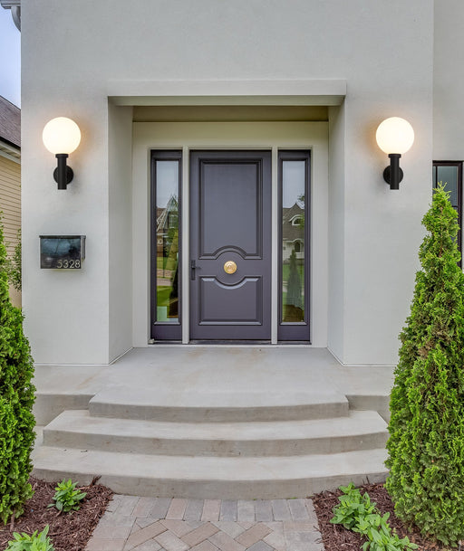 Laurent 1 Light 12" Outdoor Wall Light in White Opal in a room setting