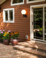 Laurent 1 Light 8" Outdoor Wall Light in White Opal in a room setting