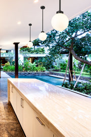 Laurent 1 Light 8" Outdoor Pendant, White Opal Shade in Black in a room setting