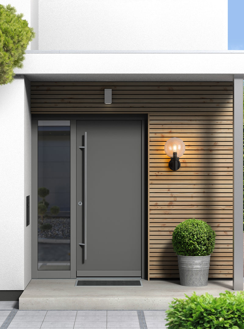 Laurent 1 Light 8" Outdoor Wall Light in Clear Seedy in a room setting