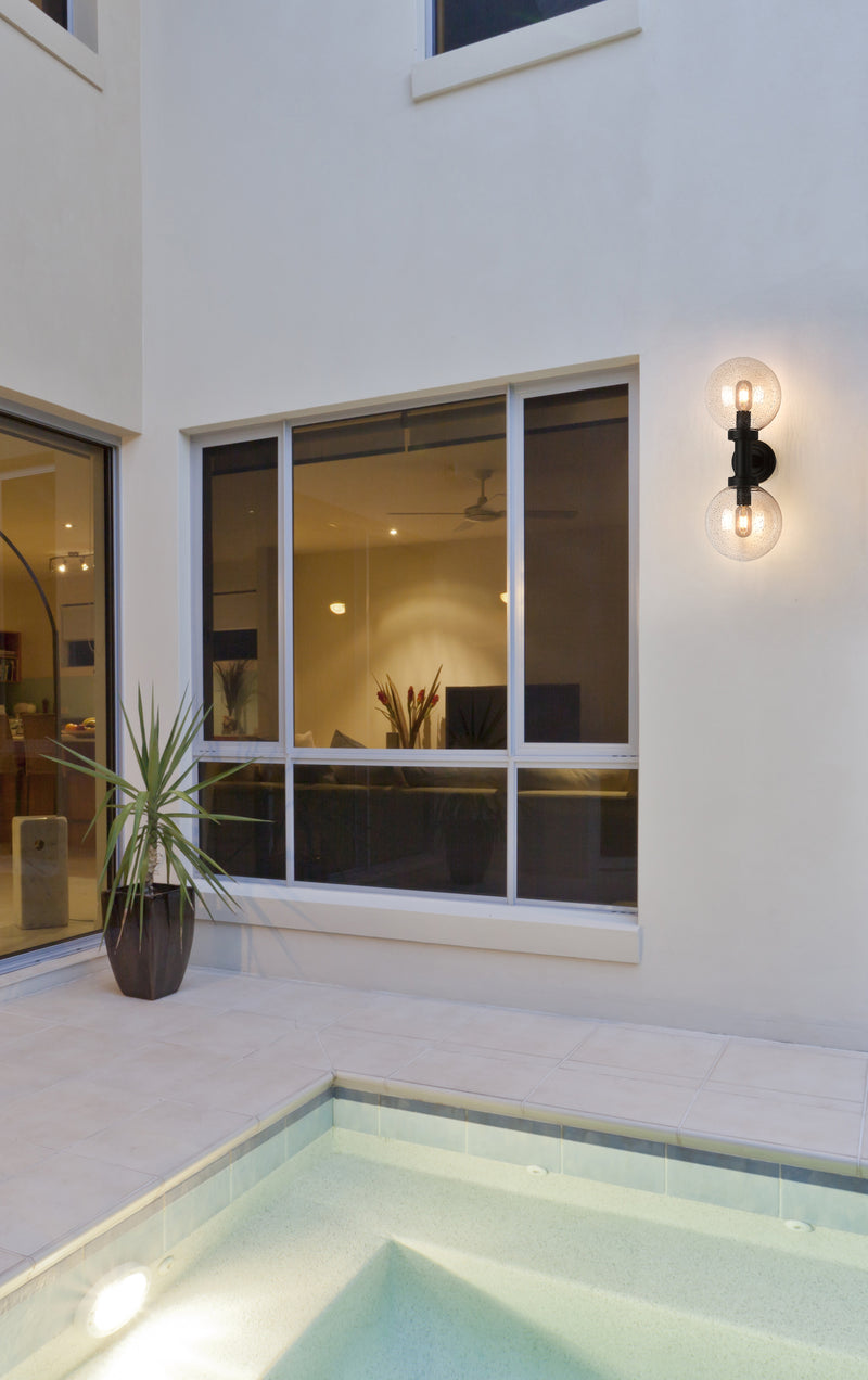 Laurent 2 Light 8" Outdoor Wall Light in Clear Seedy in a room setting