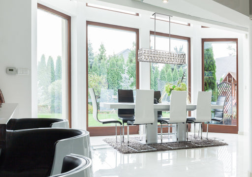 Dealey 7 Light Linear Pendant in Chrome in a room setting