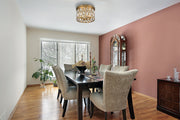 Dealey 4 Light Flush Mount in Heirloom Brass in a room setting