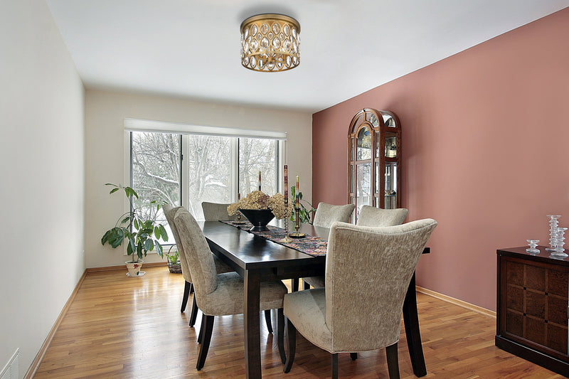 Dealey 4 Light Flush Mount in Heirloom Brass in a room setting