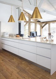 Eaton 1 Light 24" Pendant in Rubbed Brass in a room setting