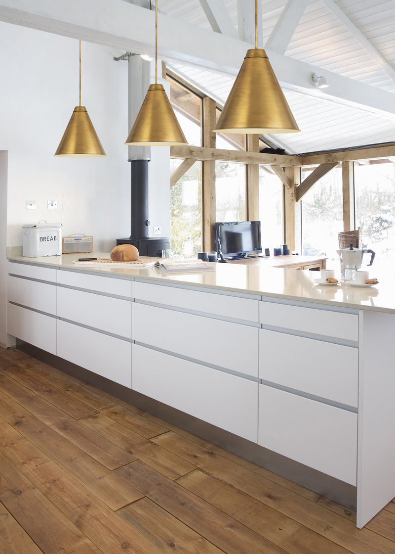 Eaton 1 Light 24" Pendant in Rubbed Brass in a room setting