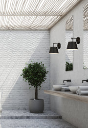 Maddox 1 Light 8" Wall Sconce in Matte Black in a room setting