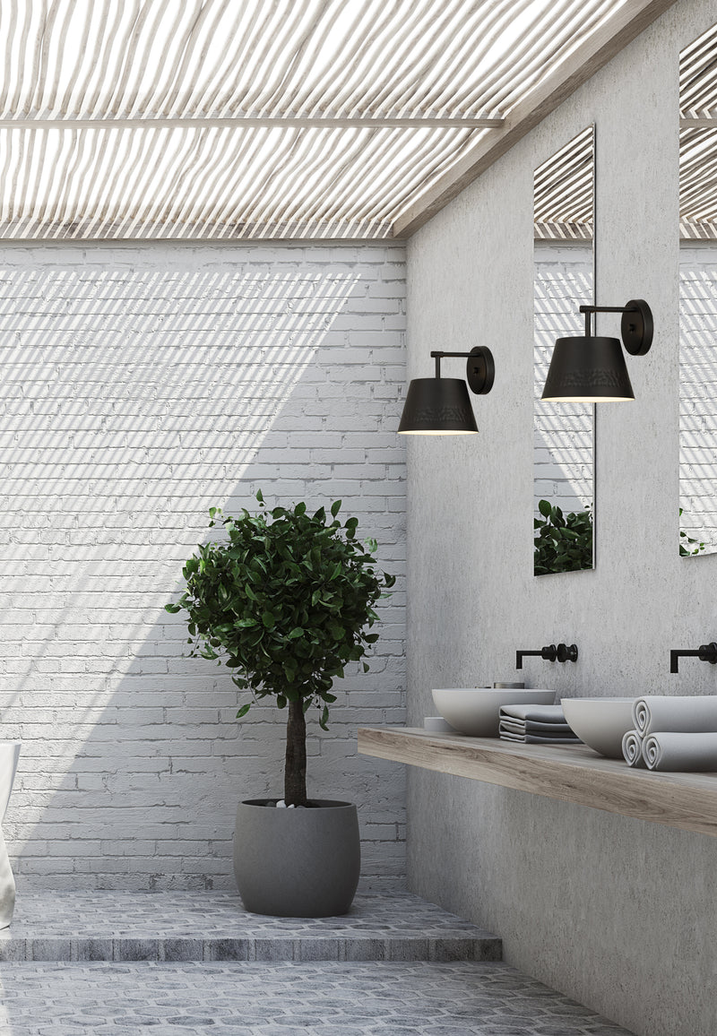 Maddox 1 Light 8" Wall Sconce in Matte Black in a room setting