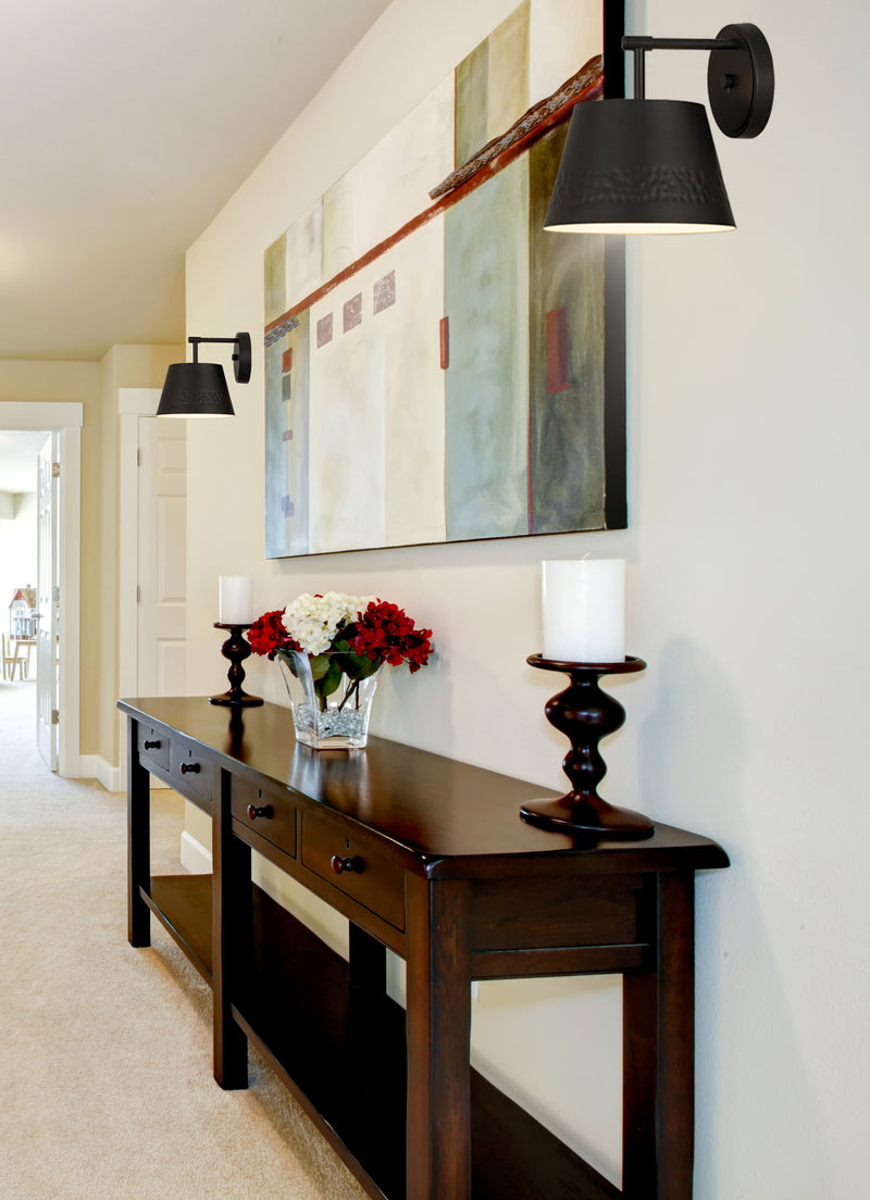Maddox 1 Light 8" Wall Sconce in Matte Black in a room setting