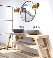 Maddox 1 Light 8" Wall Sconce in Rubbed Brass in a room setting