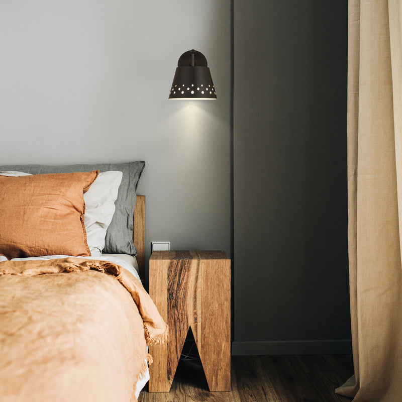 Katie 1 Light 8" Wall Sconce in Matte Black in a room setting
