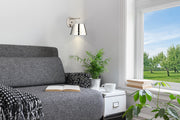 Katie 1 Light 8" Wall Sconce in Polished Nickel in a room setting