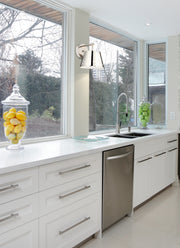 Katie 1 Light 8" Wall Sconce in Polished Nickel in a room setting