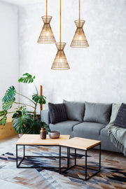 Alito 1 Light 11" Pendant in Rubbed Brass in a room setting