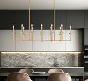 Gaultier 12 Light 56.75" Linear Pendant in Modern Gold in a room setting