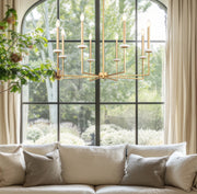 Gaultier 8 Light 35.25" Chandelier in Modern Gold in a room setting