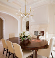 Toussant 6 Light 32" Chandelier in Modern Gold in a room setting