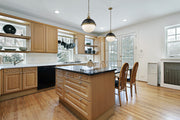 Peyton 2 Light Pendant in Matte Black + Factory Bronze in a room setting
