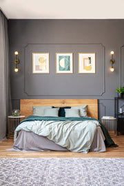 Neutra 2 Light 6" Wall Sconce in Matte Black + Foundry Brass in a room setting