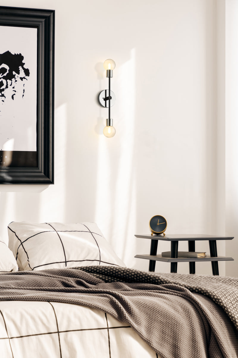 Neutra 2 Light 6" Wall Sconce in Matte Black + Polished Nickel in a room setting