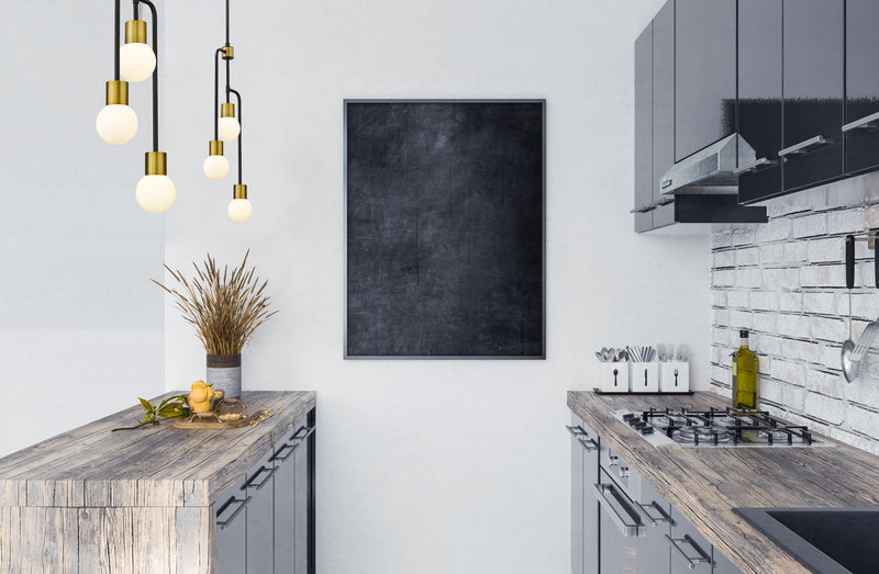 Neutra 3 Light 11.75" Chandelier in Matte Black + Foundry Brass in a room setting