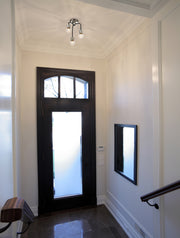 Neutra 3 Light 14" Semi Flush Mount in Matte Black + Polished Nickel in a room setting
