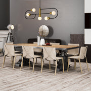 Neutra 5 Light 44" Linear Pendant in Matte Black + Foundry Brass in a room setting