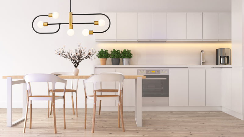 Neutra 5 Light 44" Linear Pendant in Matte Black + Foundry Brass in a room setting