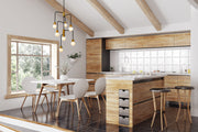 Neutra 7 Light 22.5" Chandelier in Matte Black + Foundry Brass in a room setting