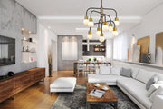 Neutra 9 Light 26.5" Chandelier in Matte Black + Foundry Brass in a room setting