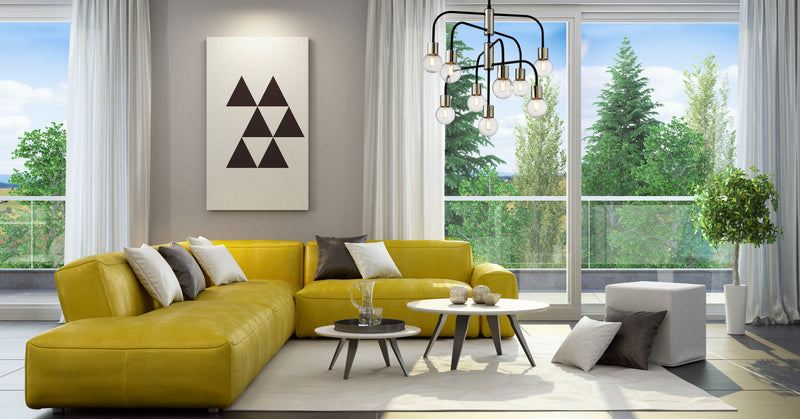 Neutra 9 Light 26.5" Chandelier in Matte Black + Polished Nickel in a room setting