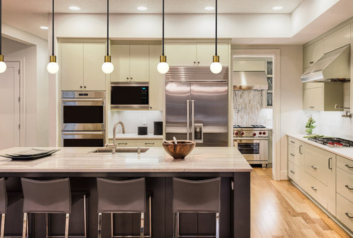 Neutra 1 Light 6" Pendant in Matte Black + Foundry Brass in a room setting