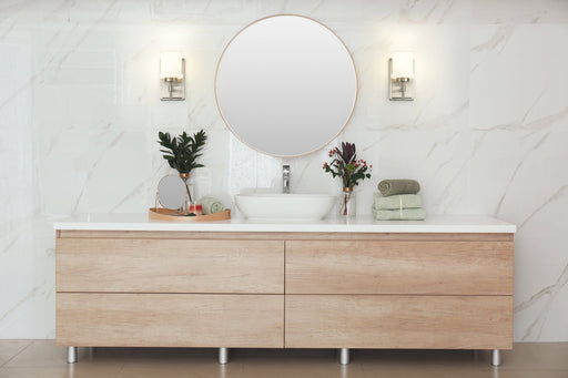 Cadoc 1 Light 4.5" Wall Sconce in Brushed Nickel in a room setting