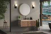 Cadoc 1 Light 4.5" Wall Sconce in Matte Black in a room setting