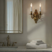 Milford 2 Light 9.5" Sconce in Aged Brass in a room setting