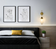 Arden 1 Light 4.5" Wall Sconce in Rubbed Brass in a room setting