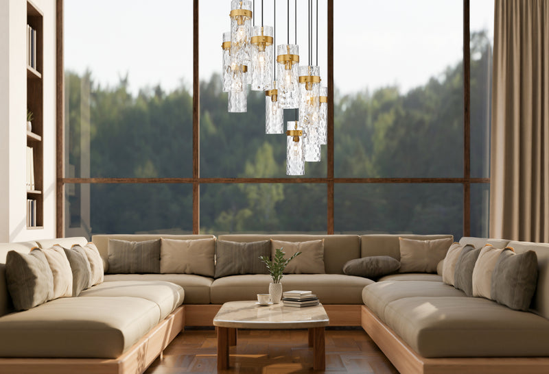 Fontaine 11 Light 26.25" Pendant in Rubbed Brass in a room setting