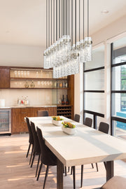 Fontaine 23 Light 54.5" Linear Pendant in Brushed Nickel in a room setting