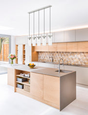 Fontaine 5 Light 44.25" Linear Pendant in Brushed Nickel in a room setting