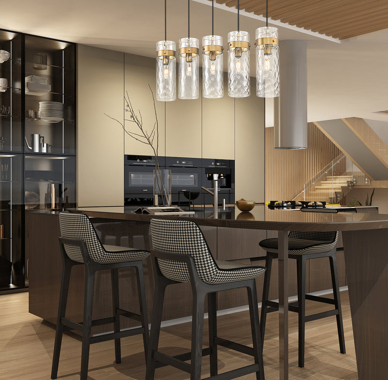 Fontaine 5 Light 44.25" Linear Pendant in Rubbed Brass in a room setting