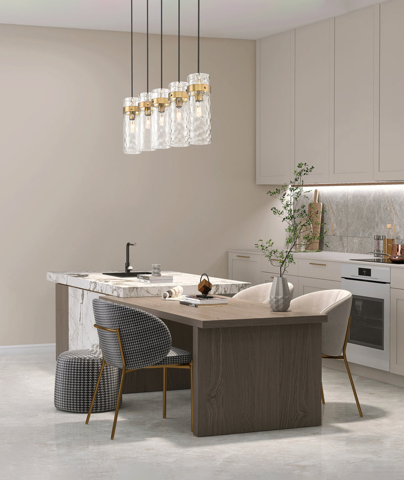 Fontaine 5 Light 44.25" Linear Pendant in Rubbed Brass in a room setting