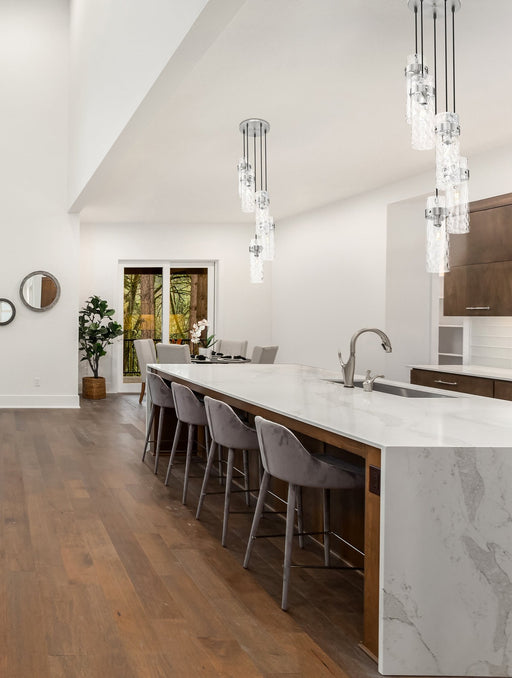 Fontaine 5 Light 14.5" Pendant in Brushed Nickel in a room setting