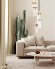 Fontaine 5 Light 14.5" Pendant in Rubbed Brass in a room setting