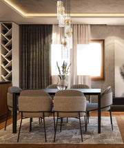 Fontaine 5 Light 14.5" Pendant in Rubbed Brass in a room setting