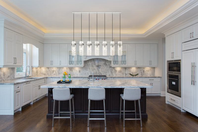 Fontaine 7 Light 56.75" Linear Pendant in Brushed Nickel in a room setting