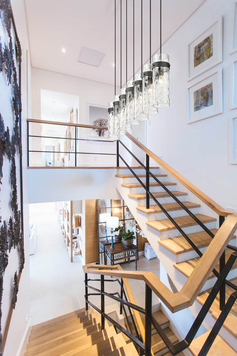 Fontaine 7 Light 56.75" Linear Pendant in Matte Black in a room setting