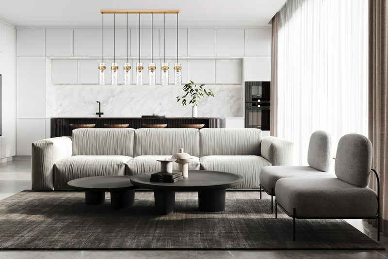 Fontaine 7 Light 56.75" Linear Pendant in Rubbed Brass in a room setting