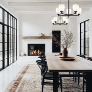 Oren 5 Light 25" Chandelier in Matte Black in a room setting
